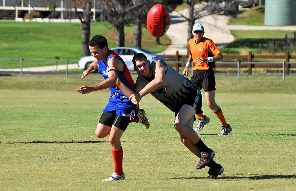 Redbacks player Matt Sinkins narrowly avoids being tackled by Demons player Luke Monk. Redbacks player Matt Sinkins narrowly avoids being tackled by Demons player Luke Monk.